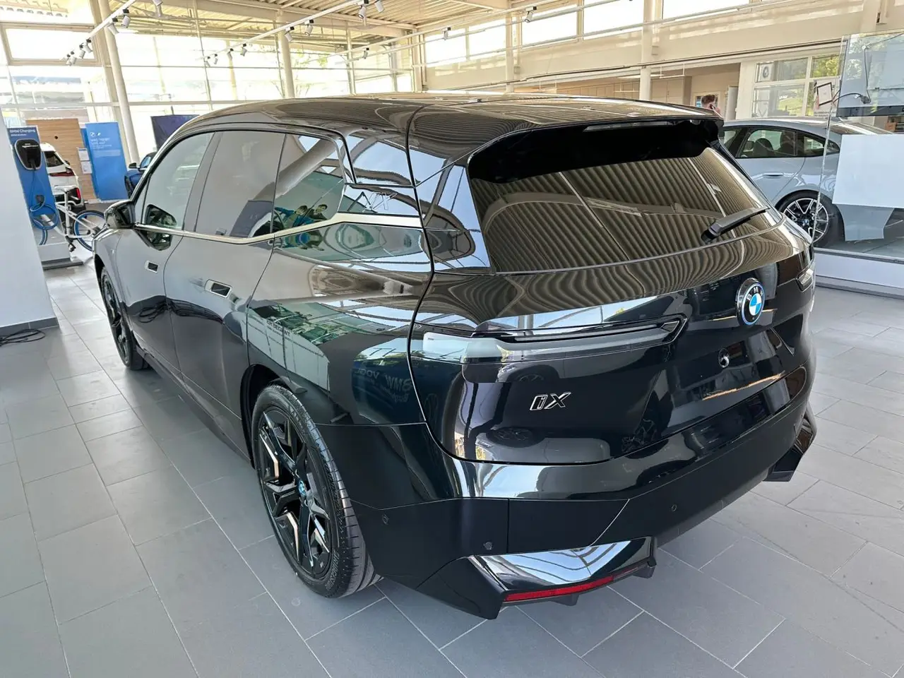 BMW IX M60 2023, rear view — Barcelona Luxury Car Rental, Barcelona. The BMW iX M60 brings 619 hp to a fully electric SUV body, and the difference is…