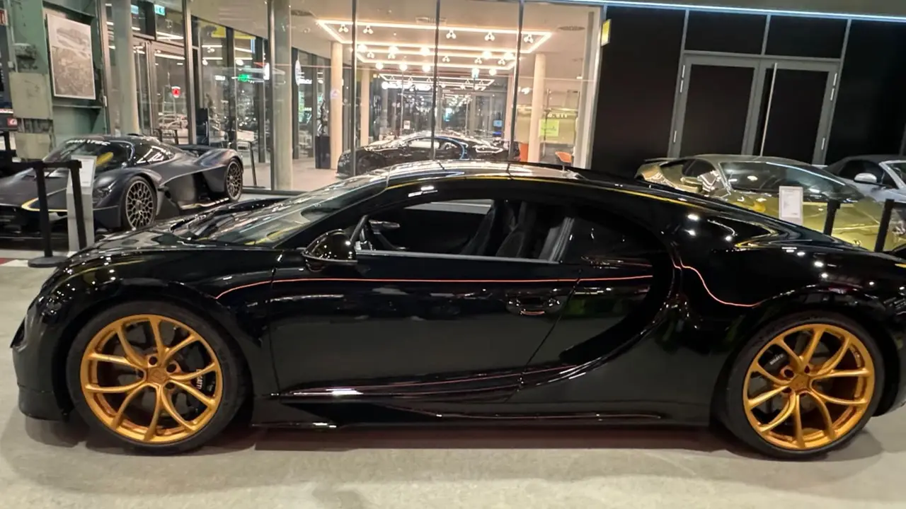 Bugatti Chiron 110 Ani 2019, side profile — Barcelona Luxury Car Rental, Barcelona. The 2019 Bugatti Chiron 110 Ans is one of the rarest cars in the collection, built to…
