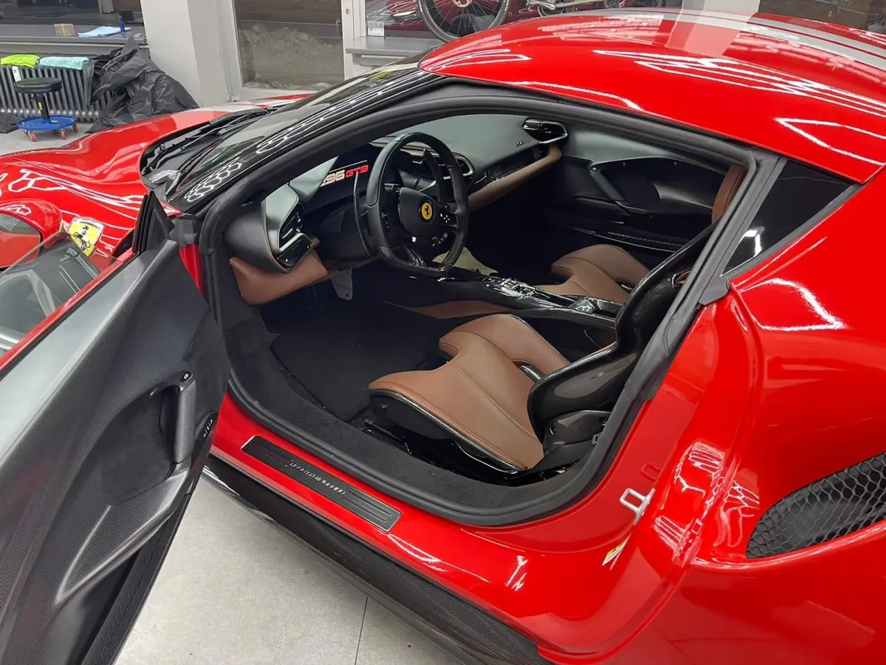 Ferrari 296 GTB 2023, front view — Barcelona Luxury Car Rental, Barcelona. The Ferrari 296 GTB pairs a twin-turbo V6 with hybrid assistance to produce 830 hp, a…