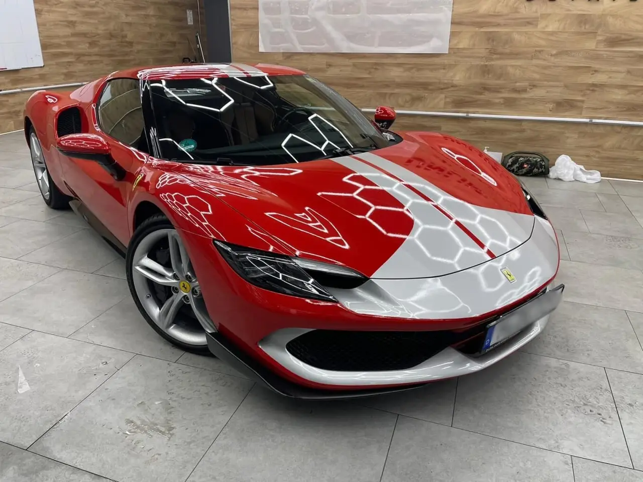 Ferrari 296 GTB 2023, rear view — Barcelona Luxury Car Rental, Barcelona. The Ferrari 296 GTB pairs a twin-turbo V6 with hybrid assistance to produce 830 hp, a…