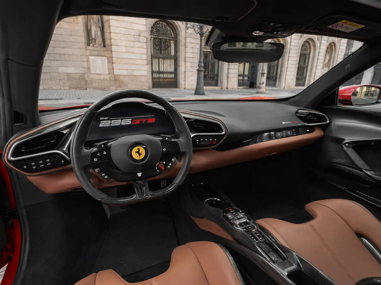 Ferrari 296 GTB 2023, interior — Barcelona Luxury Car Rental, Barcelona. The Ferrari 296 GTB pairs a twin-turbo V6 with hybrid assistance to produce 830 hp, a…
