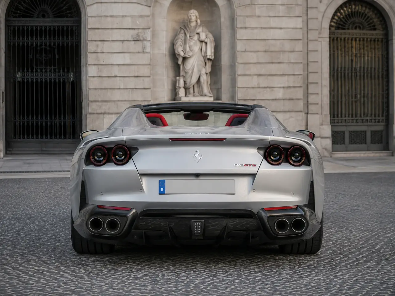Ferrari 812 GTS 2024, rear view — Barcelona Luxury Car Rental, Barcelona. The Ferrari 812 GTS pairs a naturally aspirated V12 with a retractable hard top,…