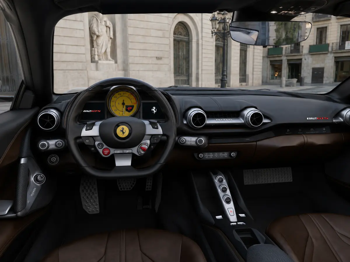 Ferrari 812 GTS 2024, interior — Barcelona Luxury Car Rental, Barcelona. The Ferrari 812 GTS pairs a naturally aspirated V12 with a retractable hard top,…