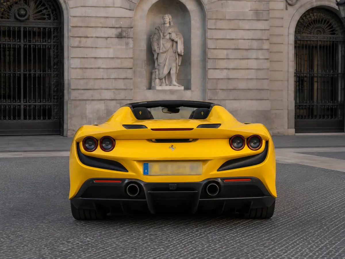 Ferrari F8 SPIDER 2023, rear view — Barcelona Luxury Car Rental, Barcelona. The Ferrari F8 Spider pairs a 720 hp twin-turbo V8 with a retractable hard top, giving…