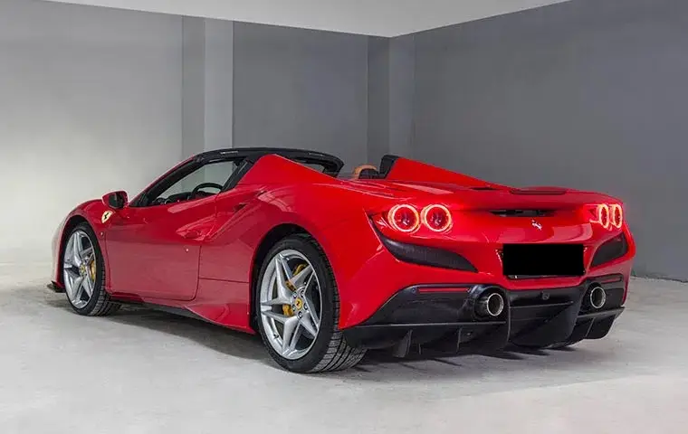 Ferrari F8 Tributo Spider Red 2023, interior — Barcelona Luxury Car Rental, Barcelona. The Ferrari F8 Tributo Spider in red pairs a twin-turbocharged V8 producing 720 hp with a…