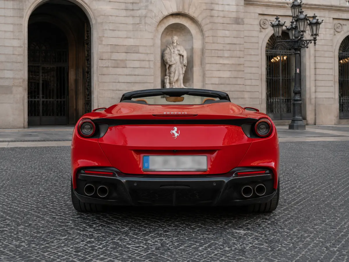 Ferrari Portofino M 2023, rear view — Barcelona Luxury Car Rental, Barcelona. The Ferrari Portofino M carries 620 hp inside a genuine four-seat convertible cabin, a…