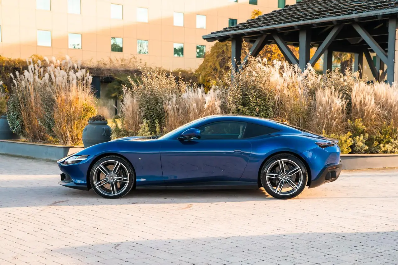 Ferrari Roma 2025, rear view — Barcelona Luxury Car Rental, Barcelona. The Ferrari Roma sits apart from the marque's mid-engined coupés: a front-engined 2+2…