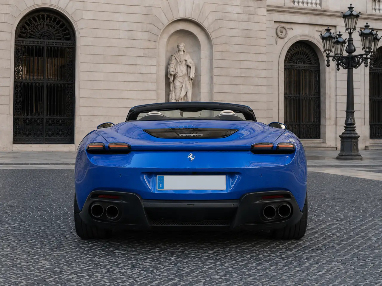 Ferrari Roma 2025, rear view — Barcelona Luxury Car Rental, Barcelona. The Ferrari Roma sits apart from the marque's mid-engined coupés: a front-engined 2+2…