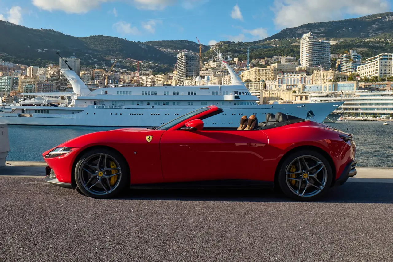 Ferrari Roma Spider 2024, exterior — Barcelona Luxury Car Rental, Barcelona. The 2024 Ferrari Roma Spider pairs 620 hp with a folding soft top, giving it a dual…