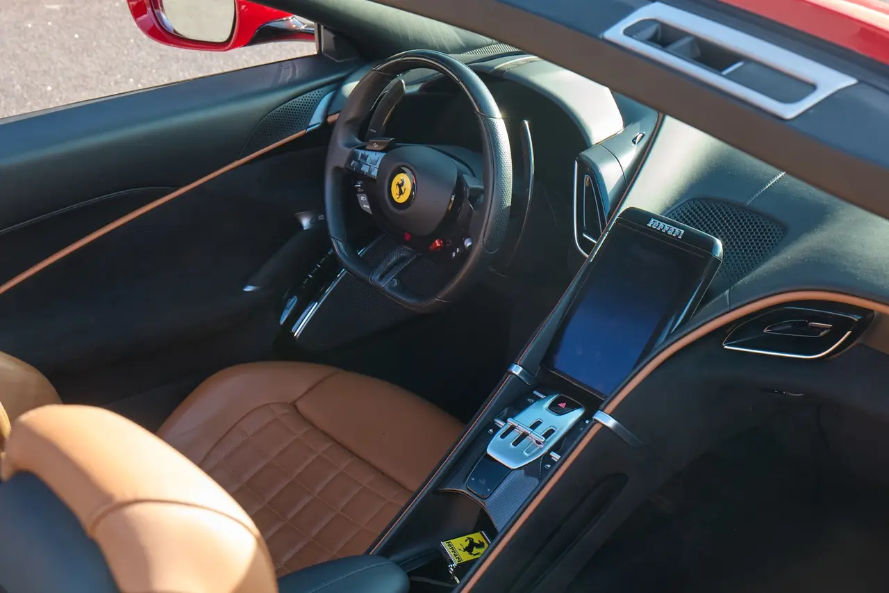 Ferrari Roma Spider 2024, rear view — Barcelona Luxury Car Rental, Barcelona. The 2024 Ferrari Roma Spider pairs 620 hp with a folding soft top, giving it a dual…