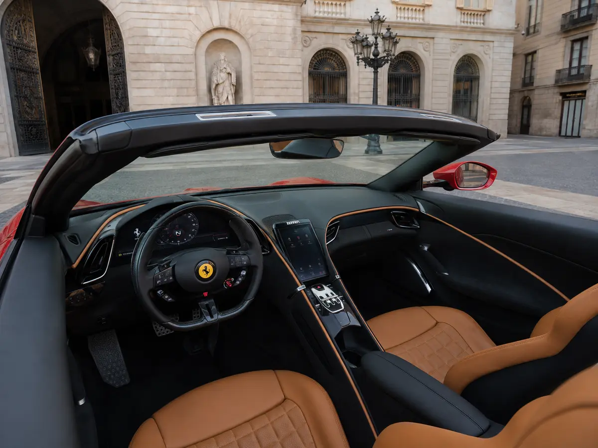 Ferrari Roma Spider 2024, interior — Barcelona Luxury Car Rental, Barcelona. The 2024 Ferrari Roma Spider pairs 620 hp with a folding soft top, giving it a dual…