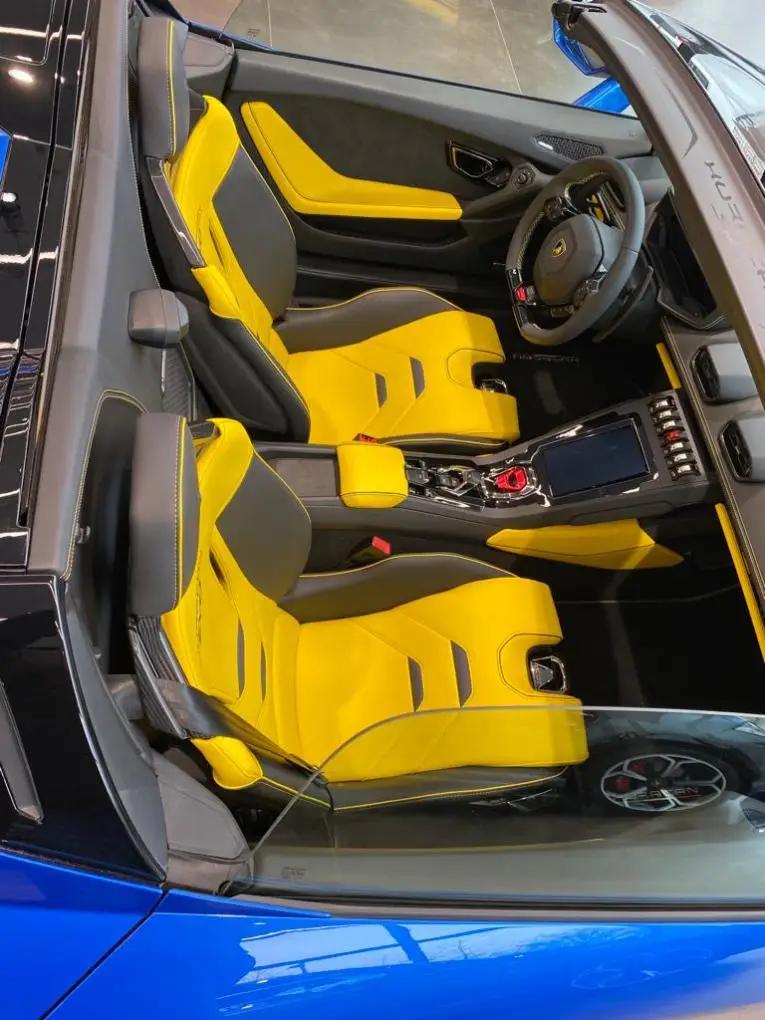 Lamborghini Huracan Evo Spyder 2022, exterior — Barcelona Luxury Car Rental, Barcelona. The 2022 Lamborghini Huracan Evo Spyder puts a naturally aspirated V10 producing 640 hp…