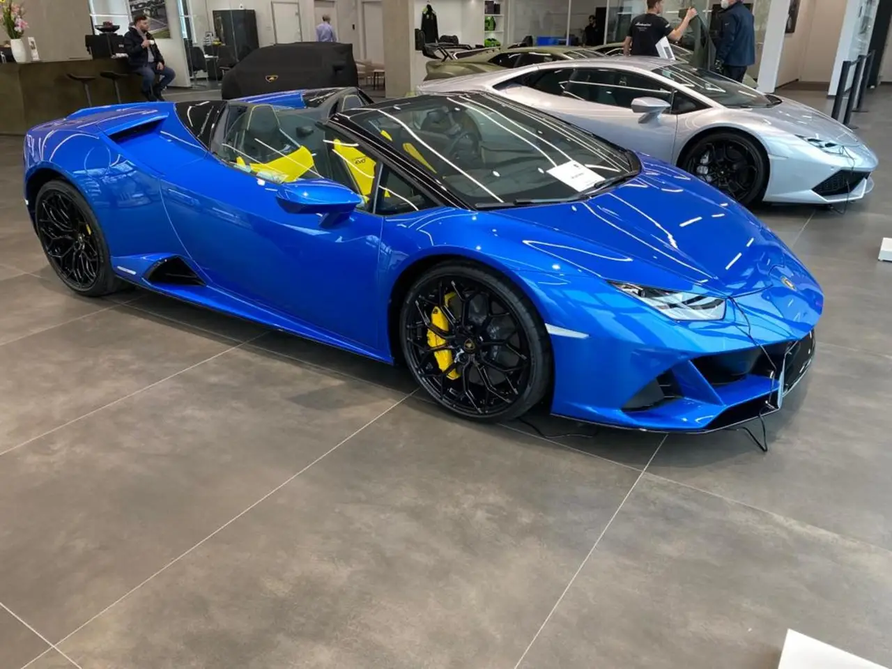 Lamborghini Huracan Evo Spyder 2022, front view — Barcelona Luxury Car Rental, Barcelona. The 2022 Lamborghini Huracan Evo Spyder puts a naturally aspirated V10 producing 640 hp…