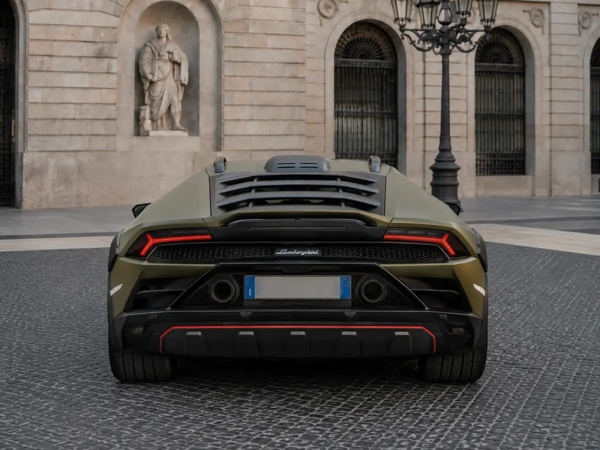 Lamborghini Huracan Sterrato 2024, rear view — Barcelona Luxury Car Rental, Barcelona. The Lamborghini Huracán Sterrato sits apart from the rest of Lamborghini's lineup: raised…