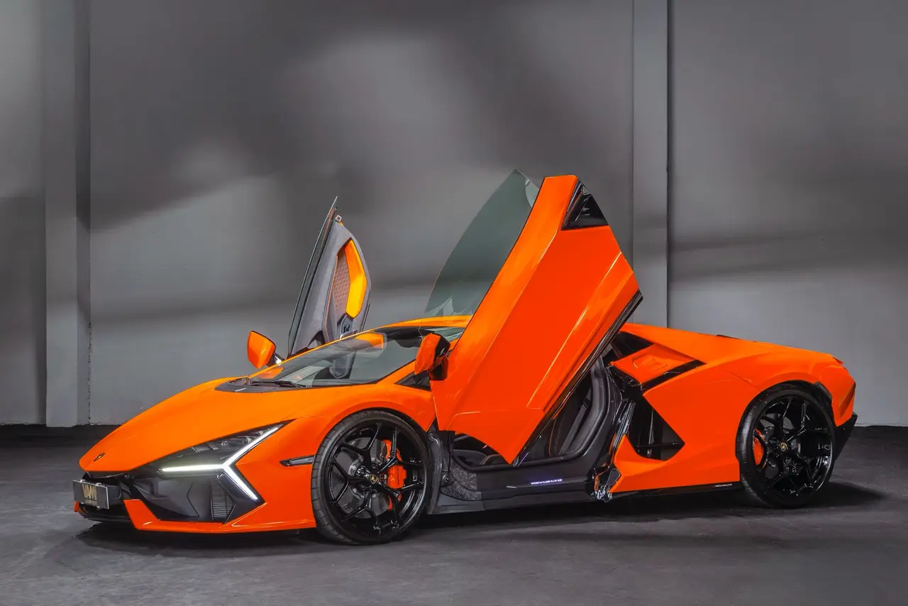 Lamborghini Revuelto 2026, exterior — Barcelona Luxury Car Rental, Barcelona. The Lamborghini Revuelto is the marque's current flagship, pairing a naturally aspirated…