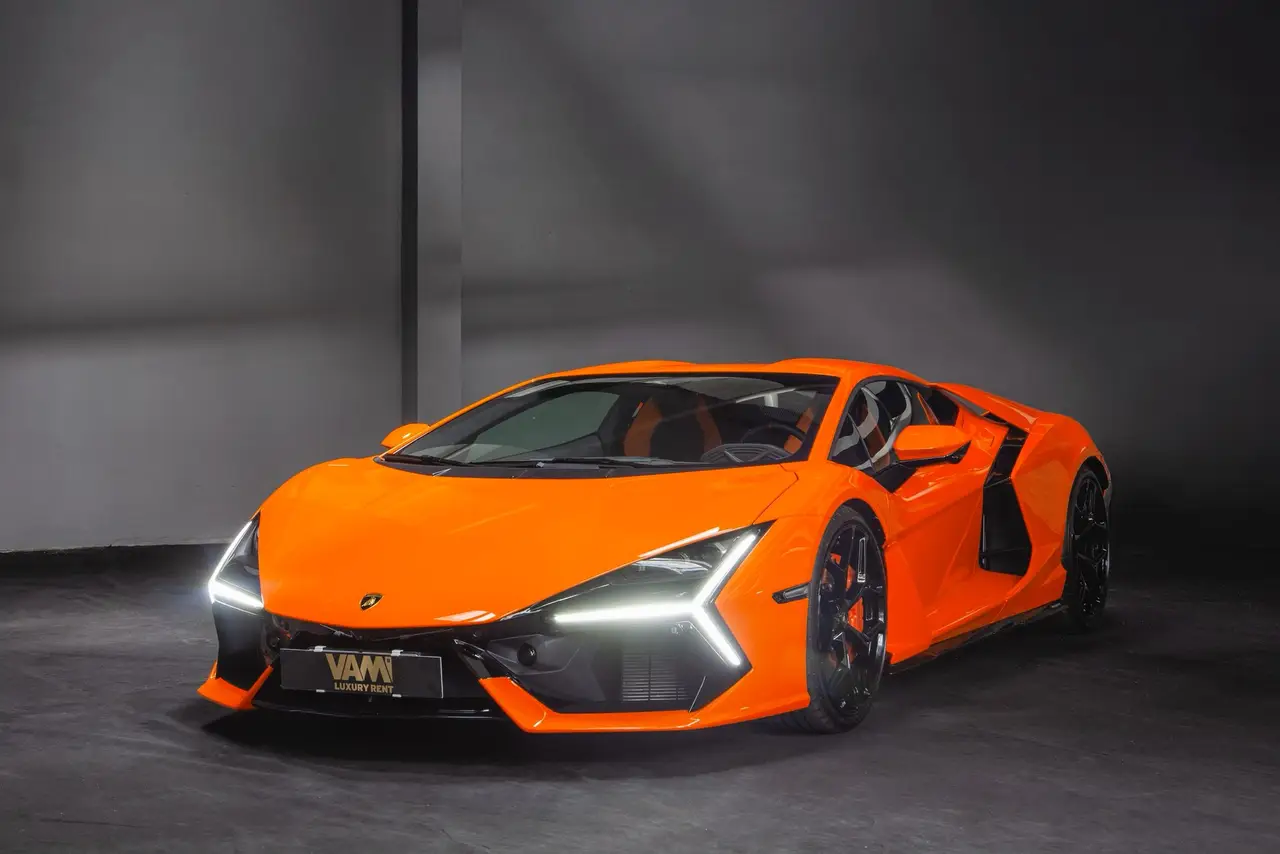 Lamborghini Revuelto 2026, front view — Barcelona Luxury Car Rental, Barcelona. The Lamborghini Revuelto is the marque's current flagship, pairing a naturally aspirated…
