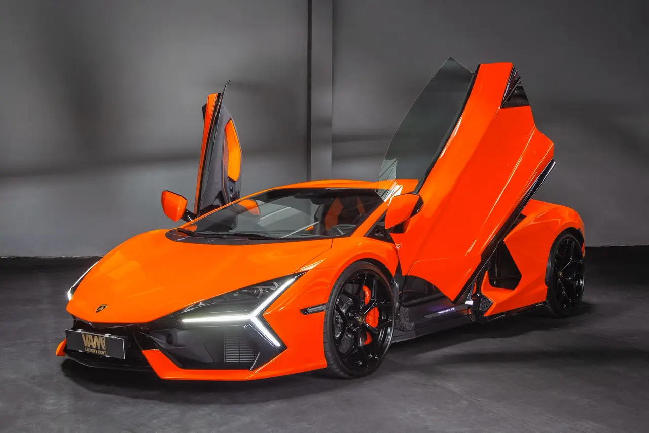 Lamborghini Revuelto 2026, side profile — Barcelona Luxury Car Rental, Barcelona. The Lamborghini Revuelto is the marque's current flagship, pairing a naturally aspirated…