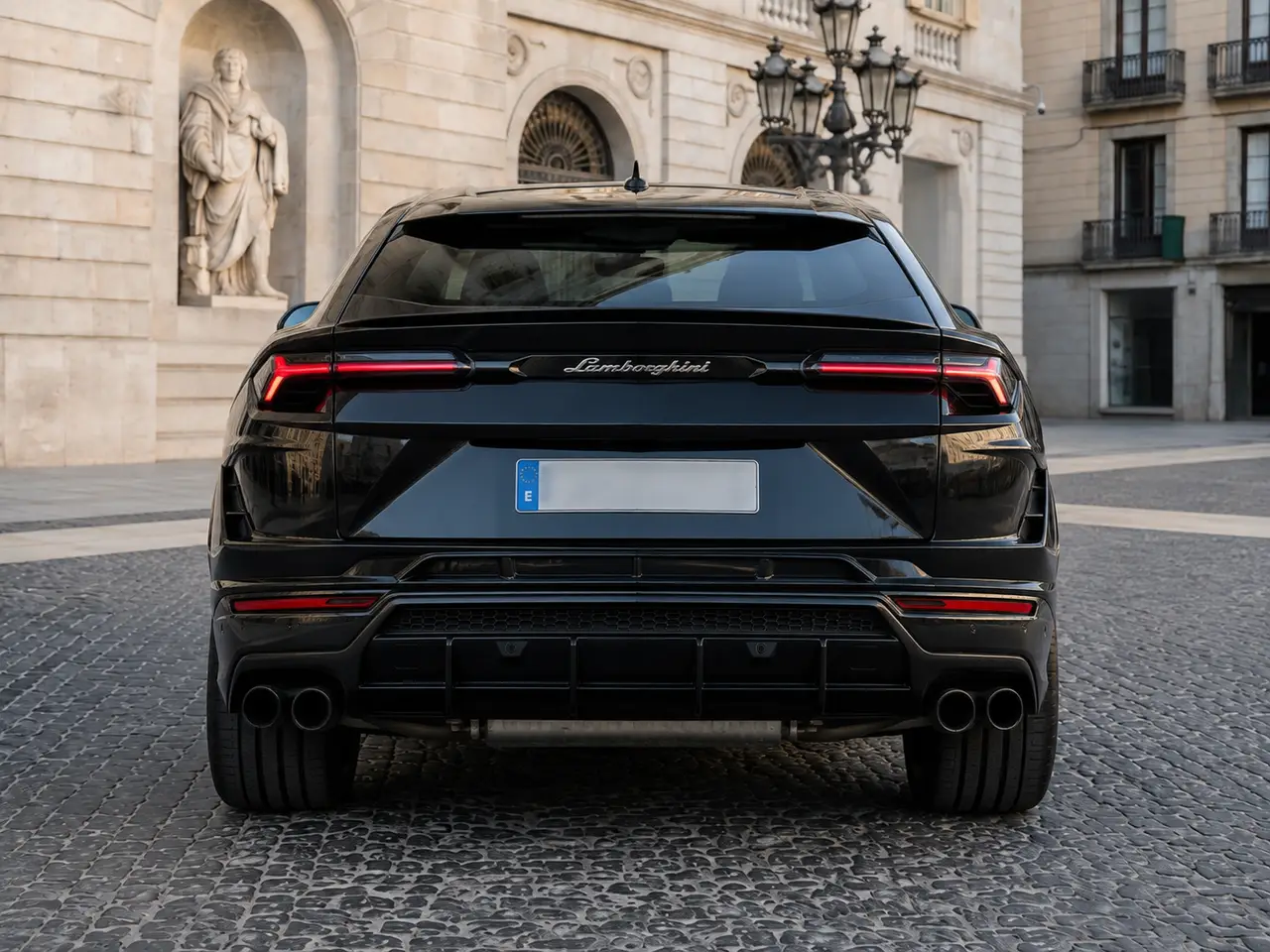 Lamborghini Urus S 2023, rear view — Barcelona Luxury Car Rental, Barcelona. The Lamborghini Urus S carries 657 hp inside a five-seat SUV body, a combination that…