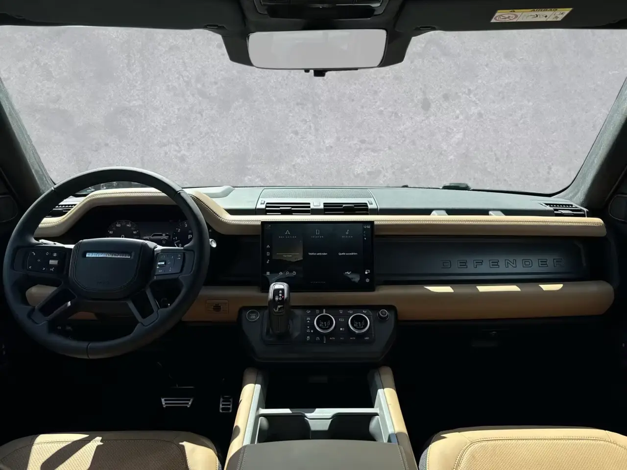 Land Rover Defender 2024, rear view — Barcelona Luxury Car Rental, Barcelona. The 2024 Land Rover Defender in this fleet carries 400 hp and seats seven, which puts it…