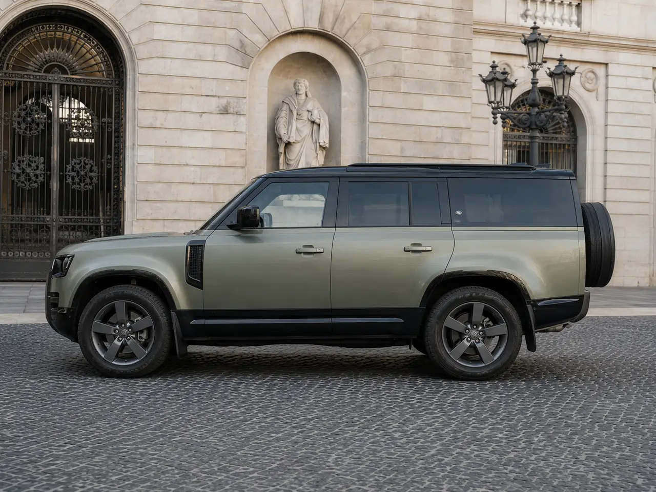 Land Rover Defender X-Dynamic 7 seater 2024, exterior — Barcelona Luxury Car Rental, Barcelona. The 2024 Land Rover Defender X-Dynamic seats seven and carries its 300 hp with the…