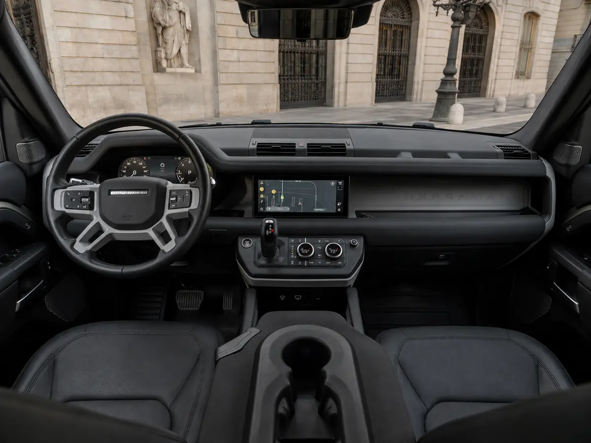 Land Rover Defender X-Dynamic 7 seater 2024, interior — Barcelona Luxury Car Rental, Barcelona. The 2024 Land Rover Defender X-Dynamic seats seven and carries its 300 hp with the…