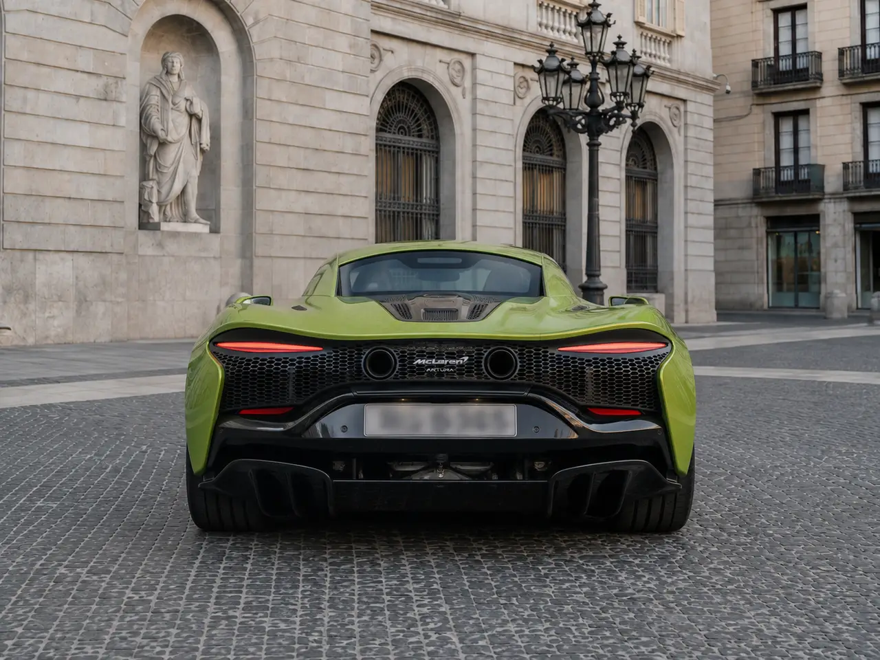 McLaren Artura Spider 2024, rear view — Barcelona Luxury Car Rental, Barcelona. The McLaren Artura Spider pairs a hybrid V6 with 671 hp in a chassis built for precision…