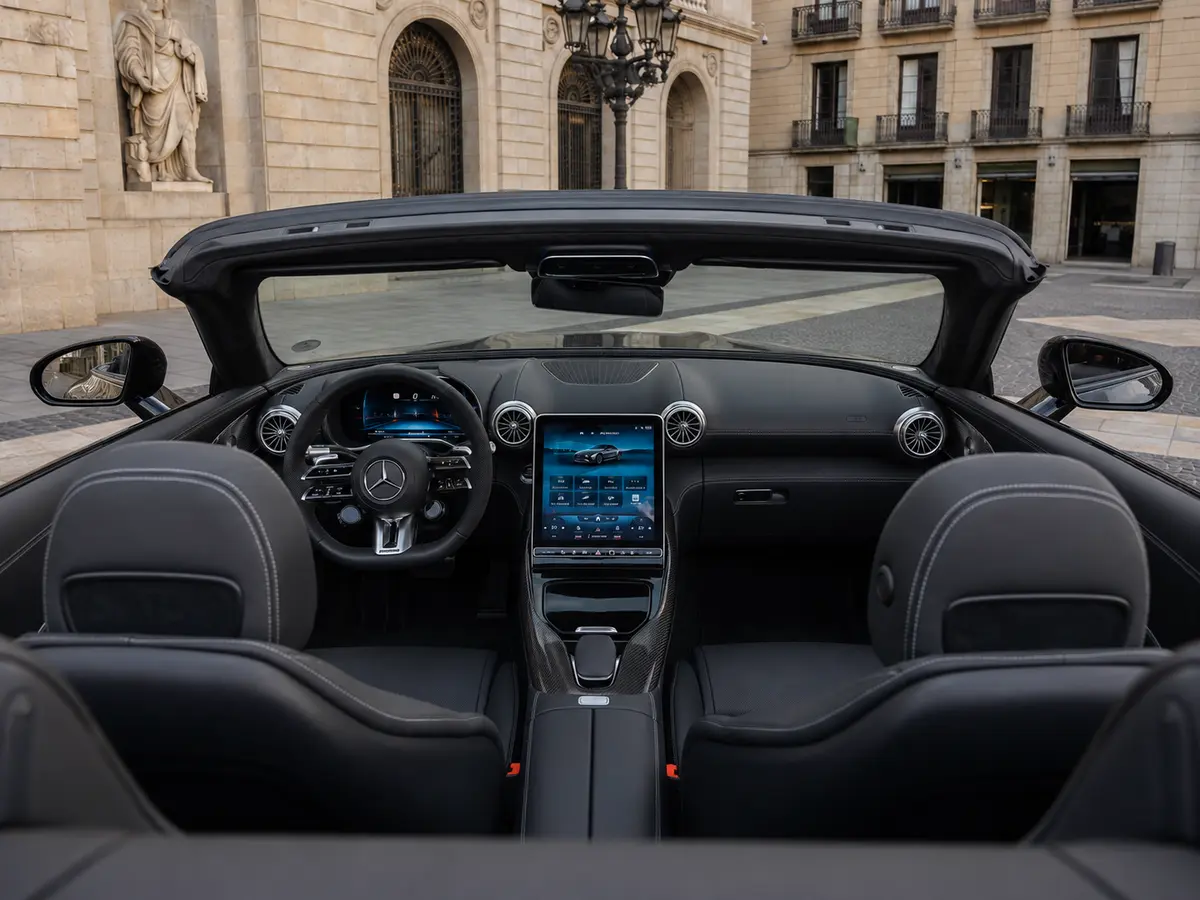 Mercedes Benz SL63 Cabrio 2023, interior — Barcelona Luxury Car Rental, Barcelona. The Mercedes Benz SL63 Cabrio pairs a 585 hp V8 with the folding hardtop mechanics that…