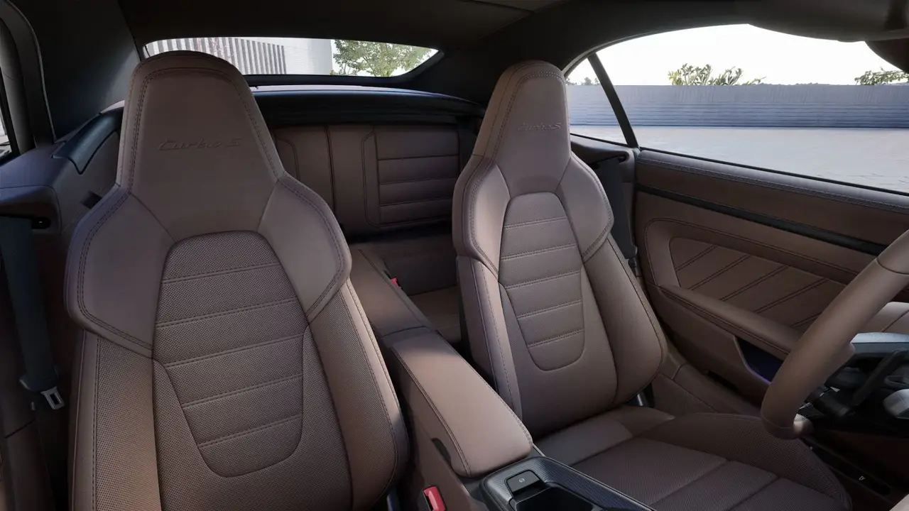 Porsche 911 992 Carrera Turbo S Cabrio 2026, interior — Barcelona Luxury Car Rental, Barcelona. The 2026 Porsche 911 992 Carrera Turbo S Cabrio pairs 650 hp with the folding roof that…