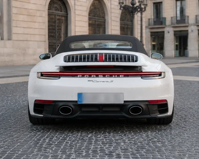 Porsche 911 Carrera S Cabrio (992) 2025, rear view — Barcelona Luxury Car Rental, Barcelona. The 2025 Porsche 911 Carrera S Cabrio (992) is the kind of car that rewards a confident…