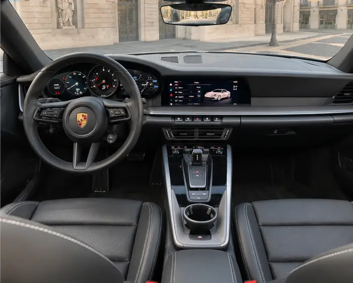 Porsche 911 Carrera S Cabrio (992) 2025, interior — Barcelona Luxury Car Rental, Barcelona. The 2025 Porsche 911 Carrera S Cabrio (992) is the kind of car that rewards a confident…